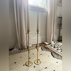 Gold vintage cast iron candle stick holder pair.